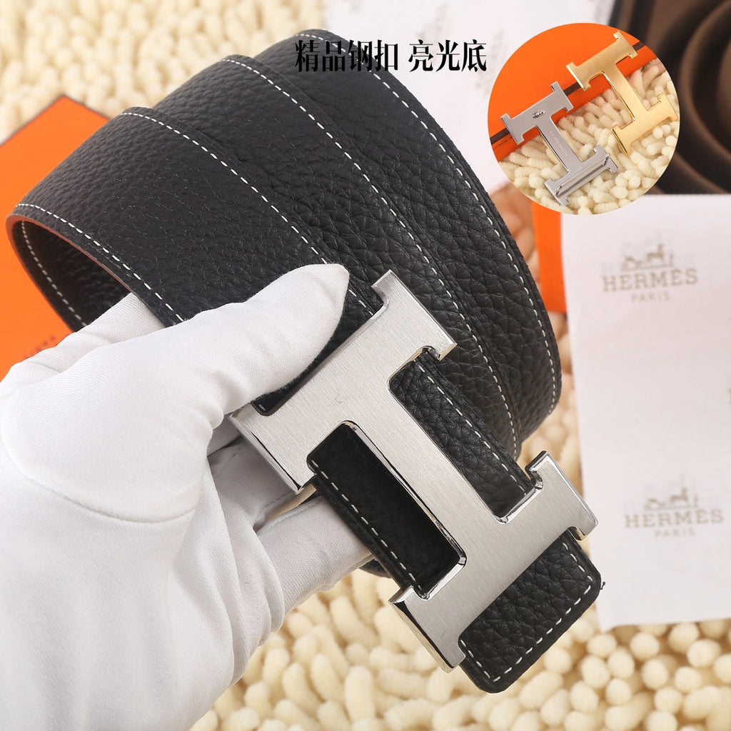 Black leather belt, gold-tone buckle, stitched strap, close-up