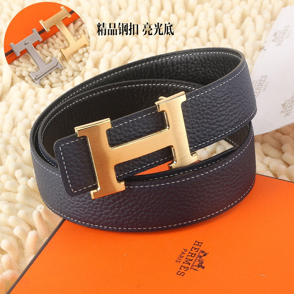 Navy leather belt with wide band and gold-toned H buckle, curved profile.