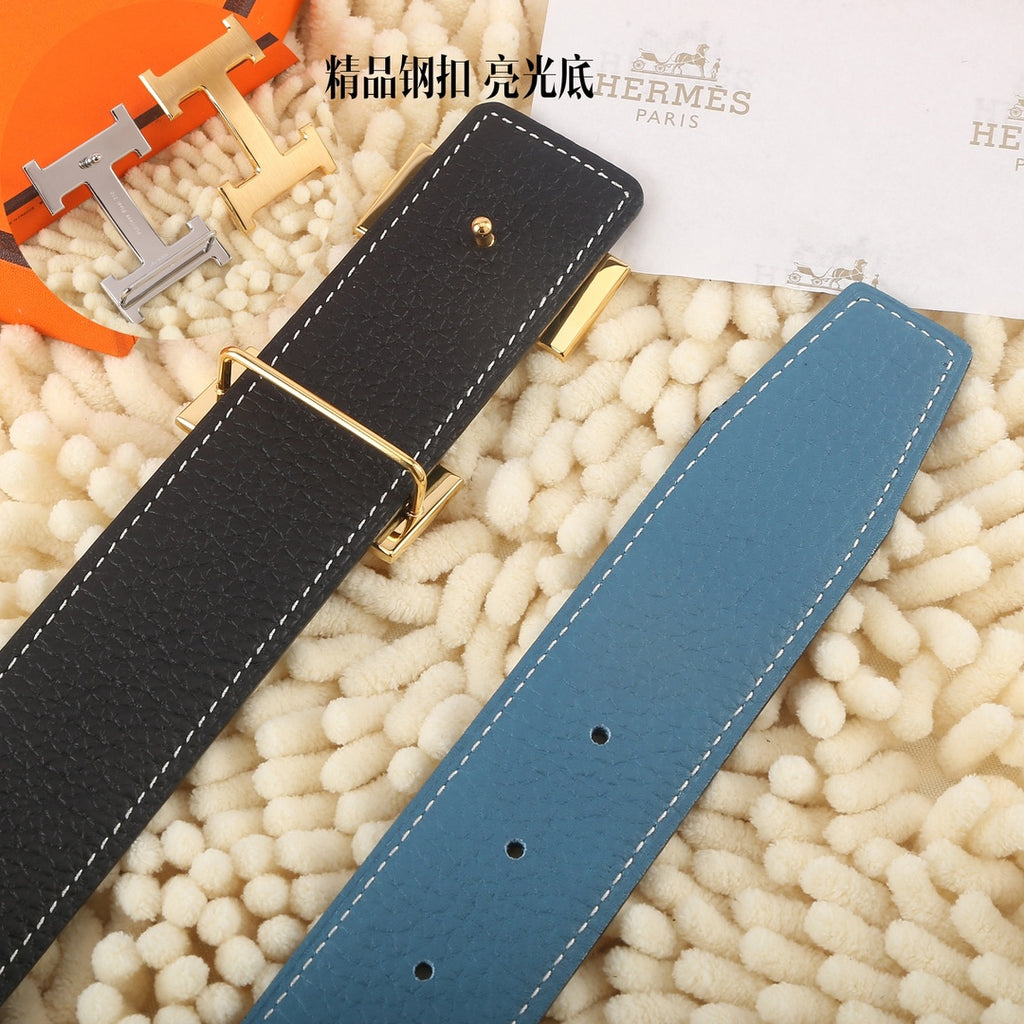 Blue and dark leather belts with gold-tone buckle and visible size holes on straps