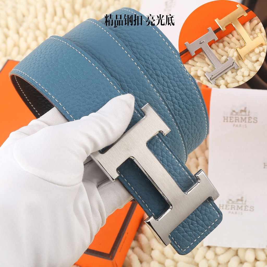 Blue Hermes leather belt with silver-tone buckle and stitched leather keeper strap