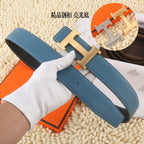 Blue leather belt with silver-tone buckle hardware and multiple size holes