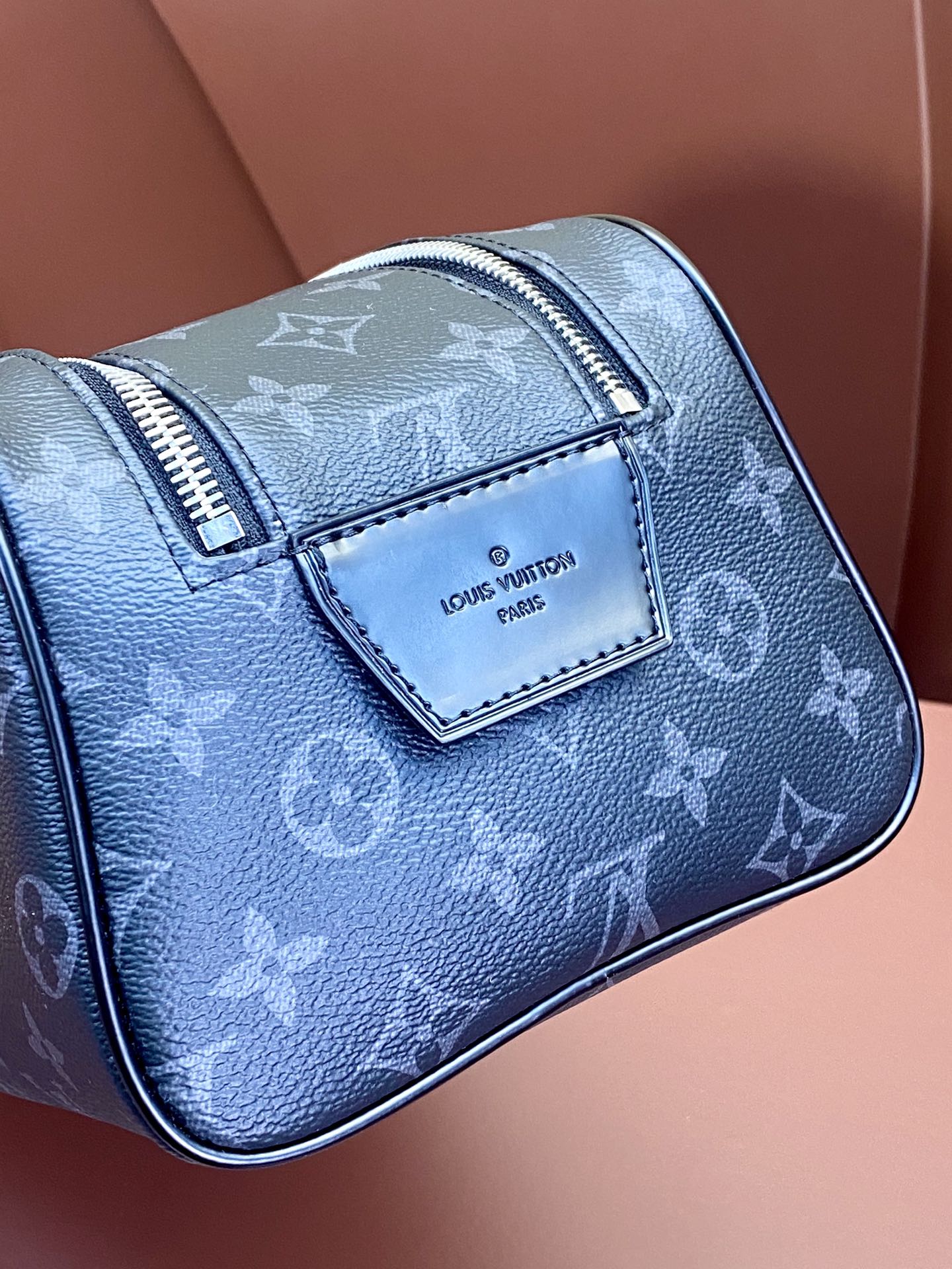 Louis Vuitton monogram bag in blue with front logo patch and zip trim