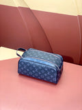 Louis Vuitton monogram bag in blue with zip closure and short handle