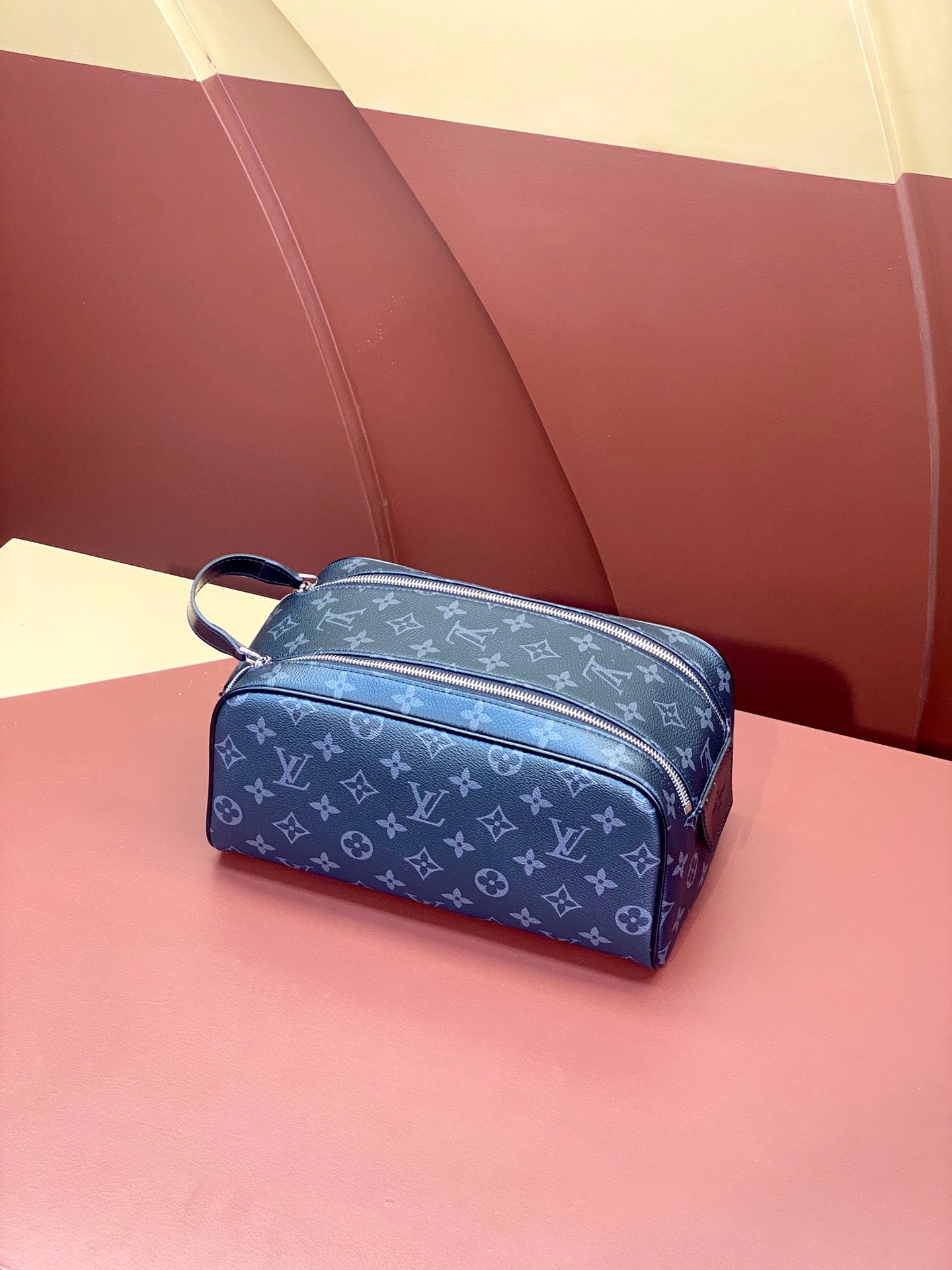 Louis Vuitton monogram bag in blue with zip closure and short handle