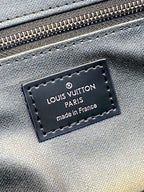 Louis Vuitton Paris logo leather patch on blue fabric with stitched edge