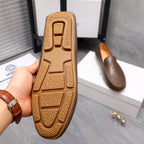 Versace brown leather loafer outsole close-up with textured tread pattern