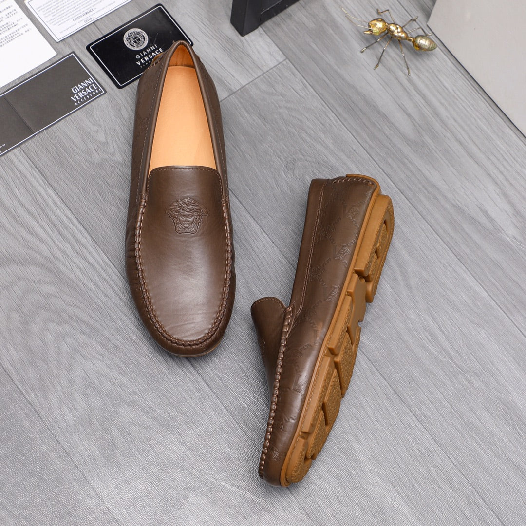 Versace brown leather loafers, front view and outsole profile with textured tread