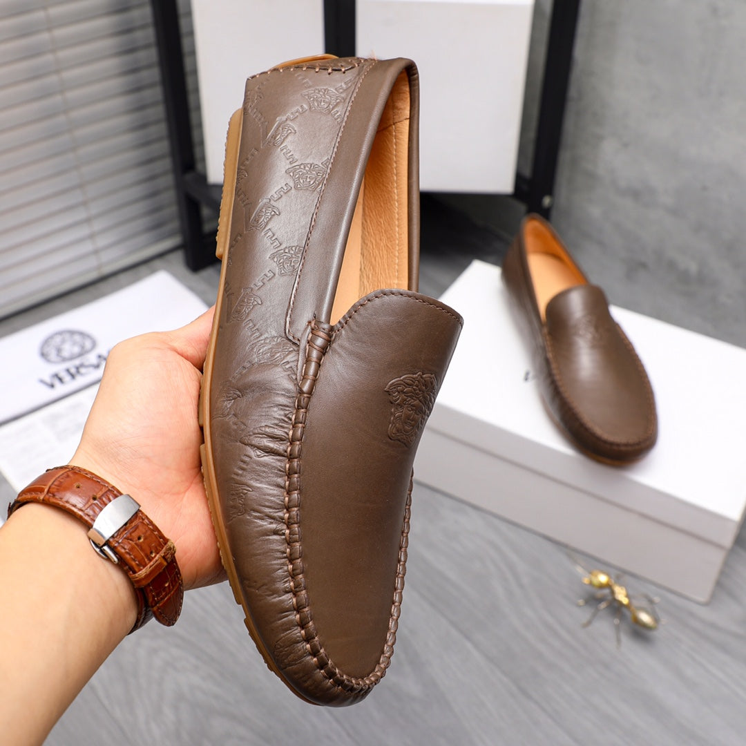 Versace brown leather loafer with embossed logo panel and moc-toe stitching