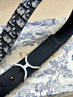 Dior belt detail with black textured leather strap and silver double-D buckle