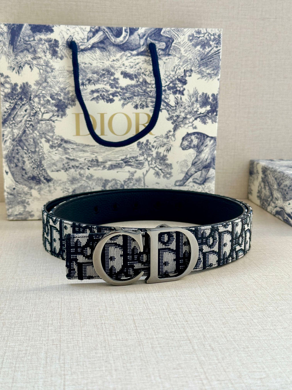 Dior belt with navy-and-white monogram strap and silver double D buckle