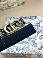 Dior belt detail: black leather strap with gold CD buckle and logo jacquard strap