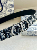 Dior belt with dark blue logo webbing and large silver-tone double-D buckle.
