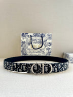Dior belt with dark blue/black logo pattern and silver-tone buckle.