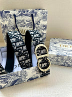 Dior belt vertical view, dark navy/black monogram strap with gold buckle