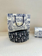 Dior belt, navy monogram strap with black buckle on patterned box