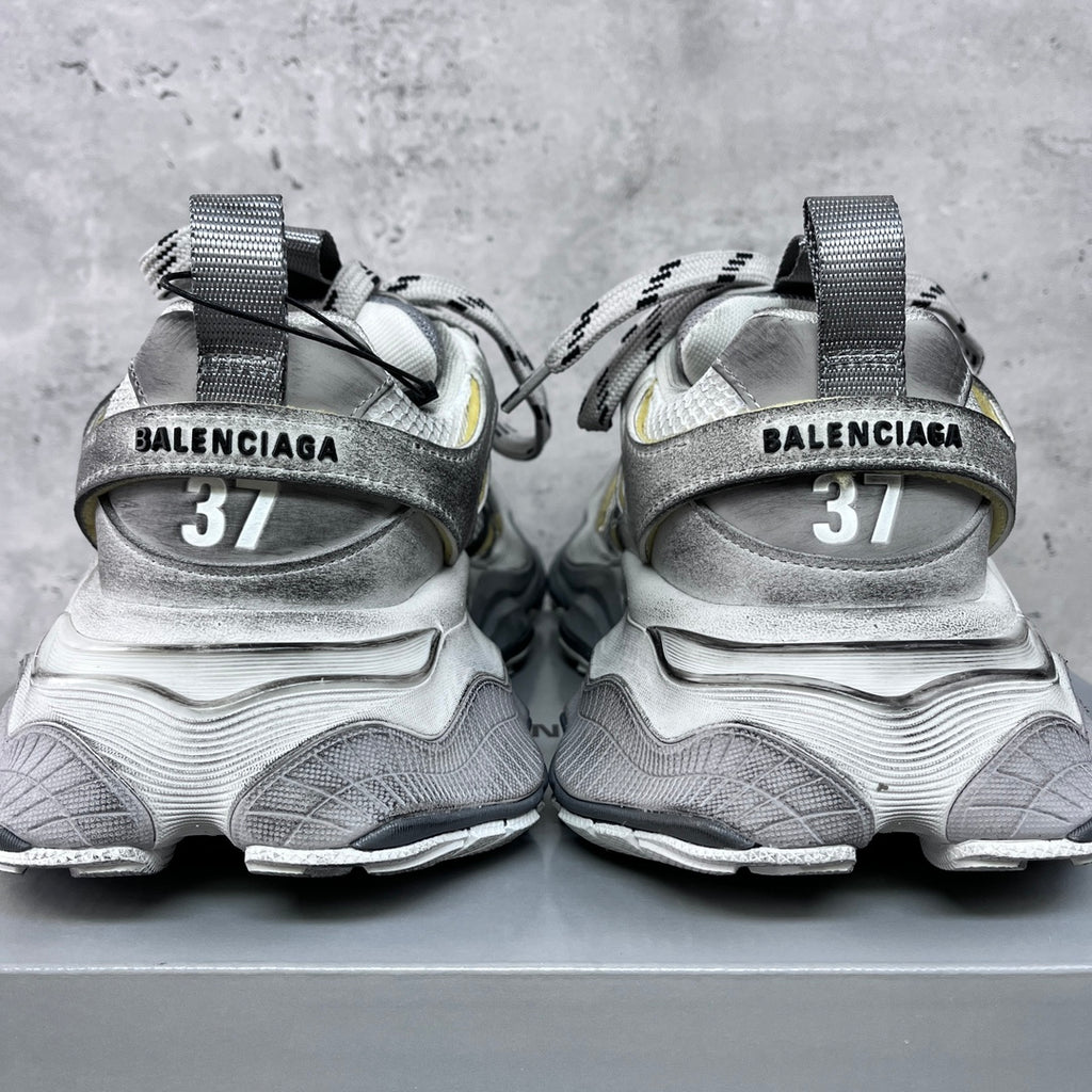 Balenciaga unisex sneakers back view, silver heels with BALENCIAGA text and size 37.