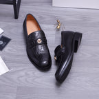 Versace black leather loafers showing buckle strap and low heel, side and back view