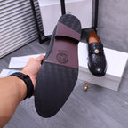 Bottom view of black Versace loafer with textured traction sole