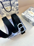 Navy fabric belt with silver CD buckle and end strap with holes