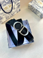 Navy web belt with silver CD buckle and textured strap detail
