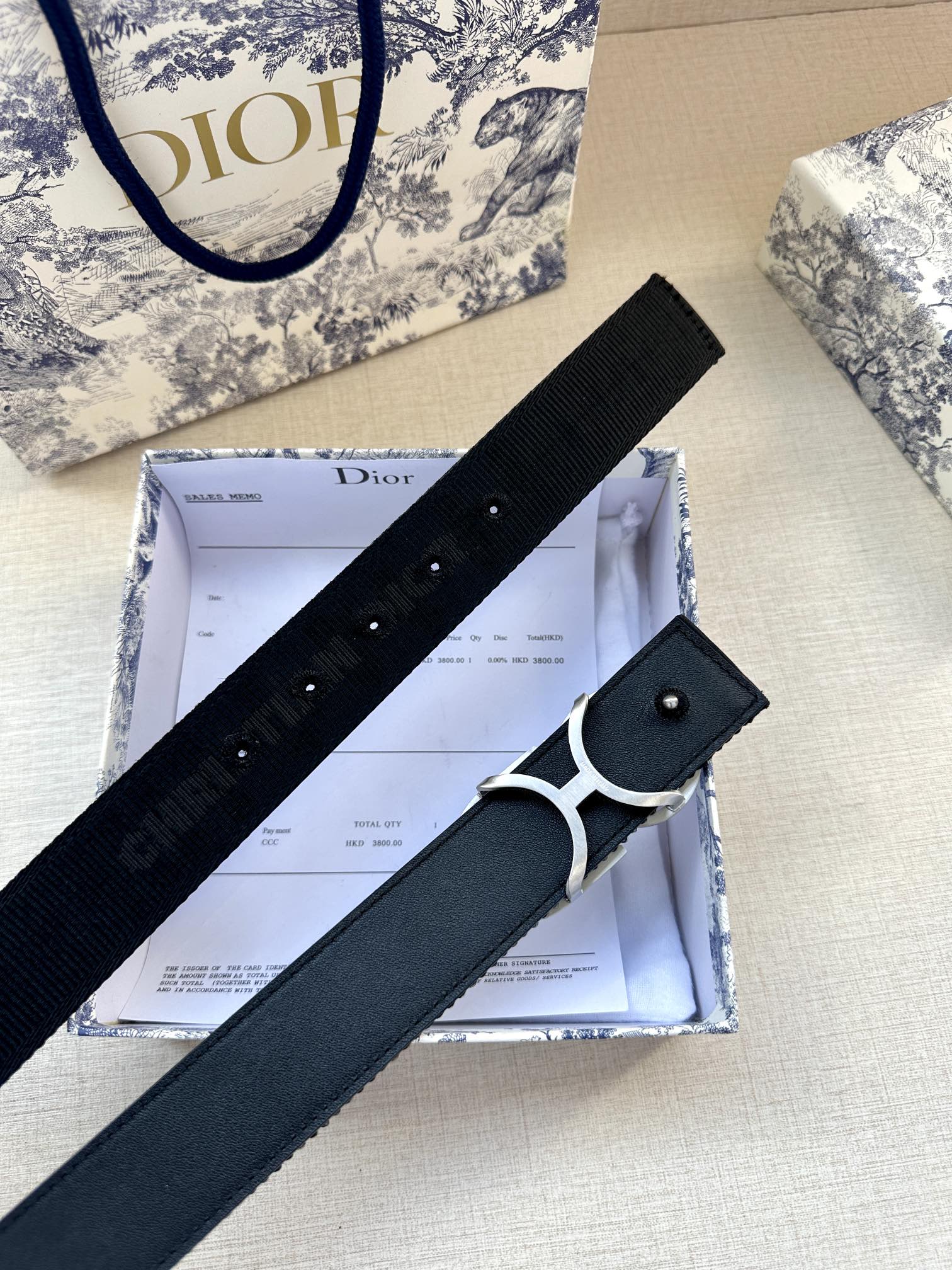 Navy fabric belt with silver CD buckle and rectangular keeper