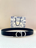 Navy fabric belt with silver-tone CD buckle and adjustable holes