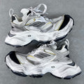 Unisex Balenciaga sneakers, silver with gold accents, lace-up, chunky black tread sole