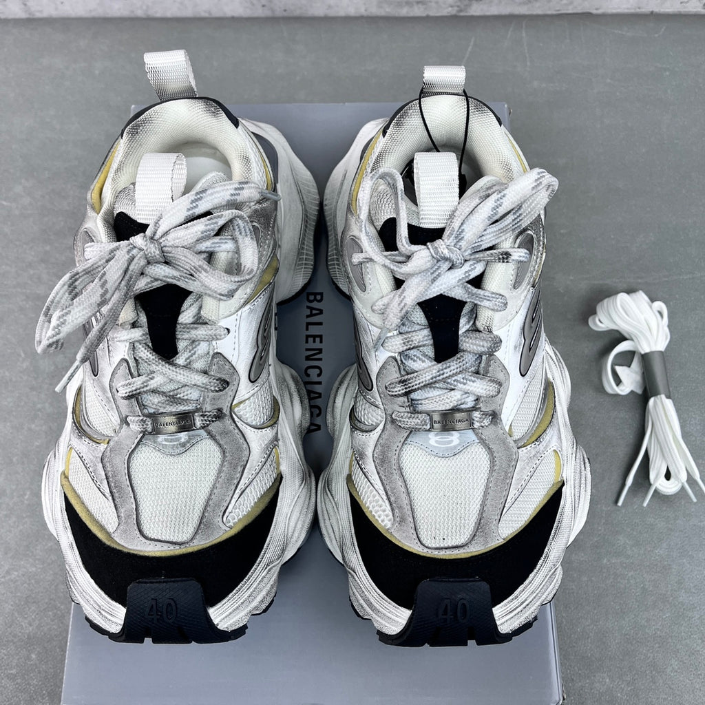 Unisex Balenciaga sneakers pair front view, silver laces, gold accents, thick black soles