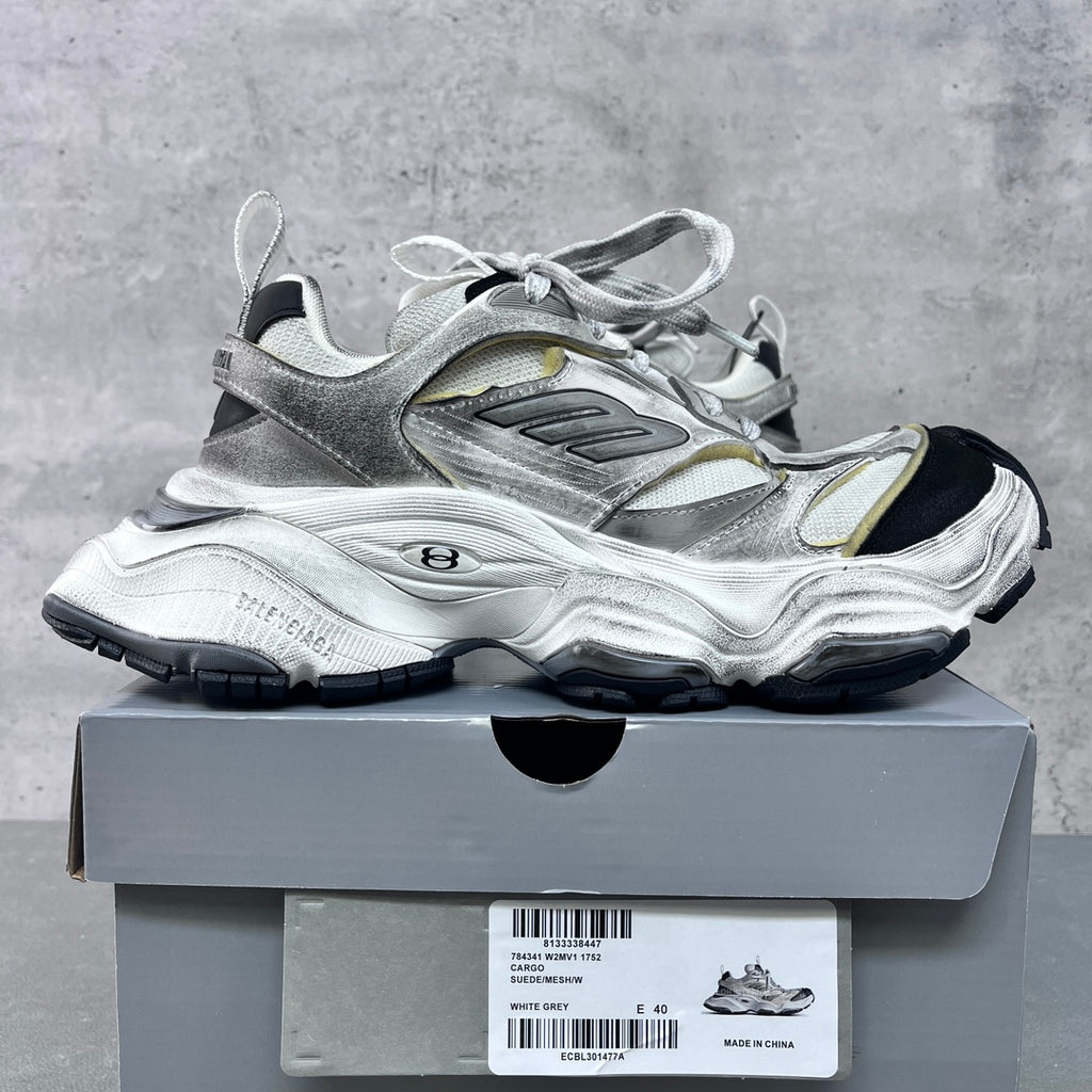 Unisex Balenciaga sneakers on box, silver with gold panels, lace-up, chunky black outsole