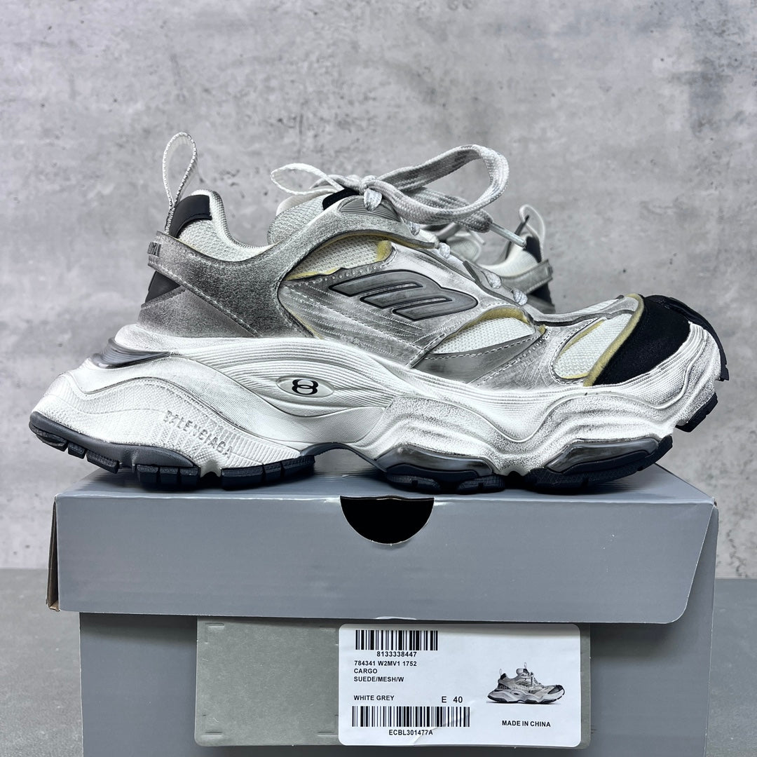 Unisex Balenciaga sneakers on box, silver with gold panels, lace-up, chunky black outsole