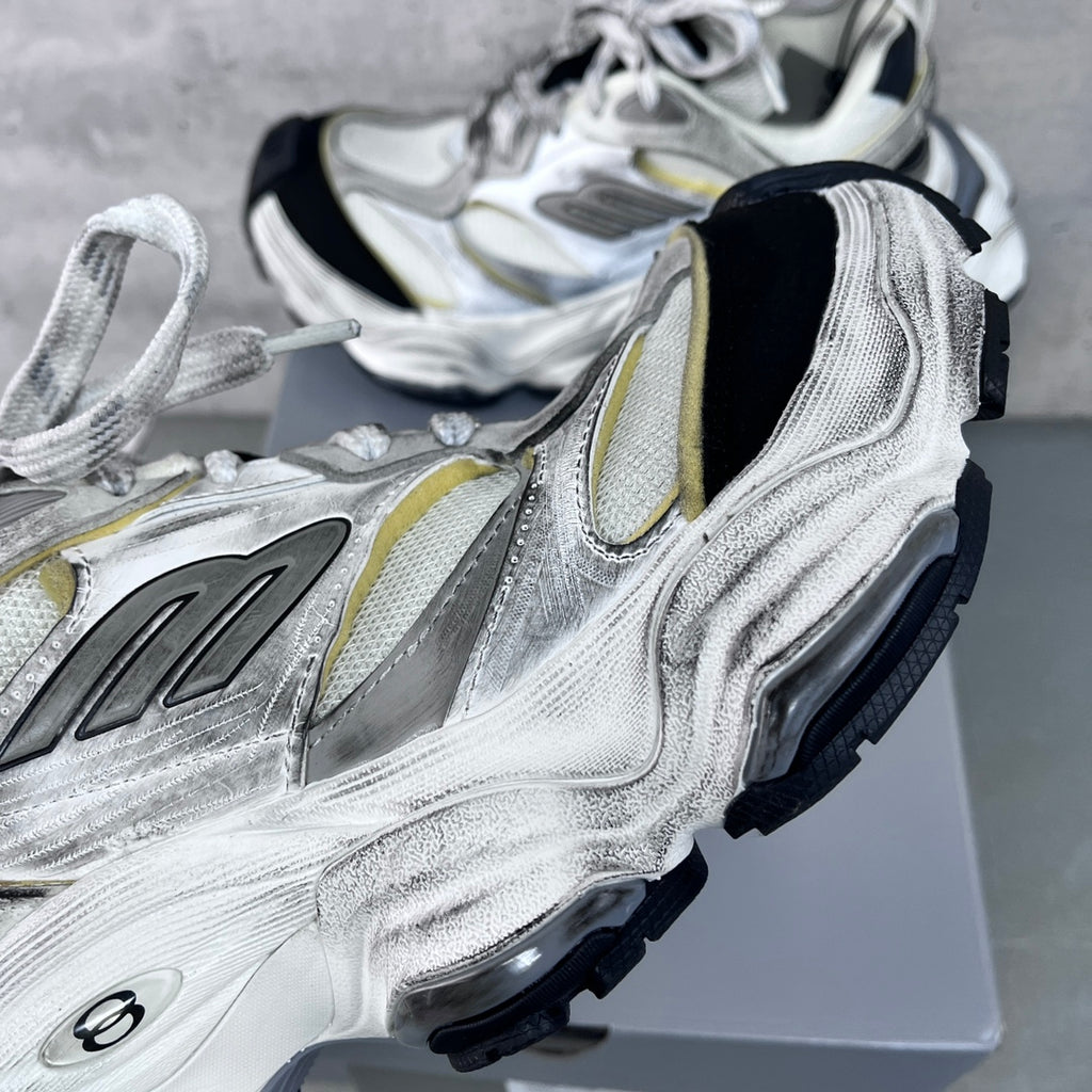 Unisex Balenciaga sneakers detail, silver leather with gold trim and textured black side panels