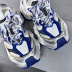 Balenciaga unisex sneakers, top view; white uppers with blue and silver details