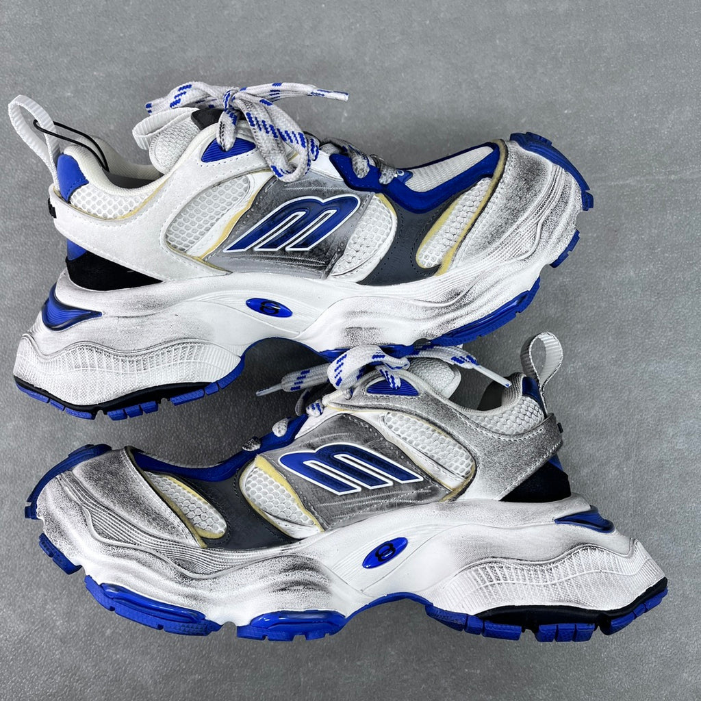 Balenciaga unisex chunky sneakers, front three-quarter view; white and silver with blue