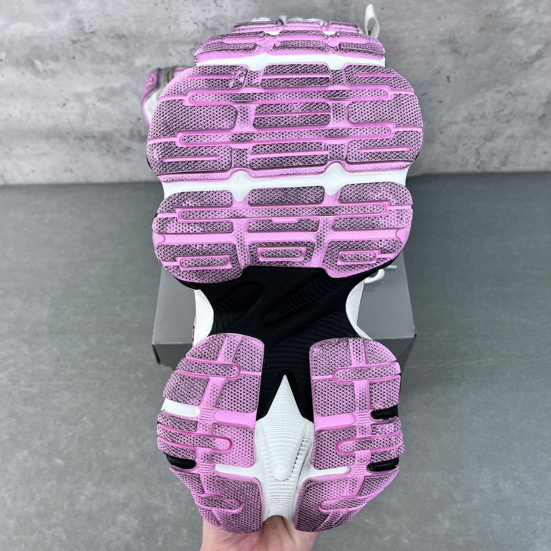 Back view sneaker pair with purple tread outsole, white uppers and raised heel panels