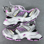 Silver and white sneakers with purple accents, lace-up design and chunky rubber outsole