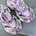 White and purple lace-up sneakers with metallic silver overlays and cushioned chunky sole