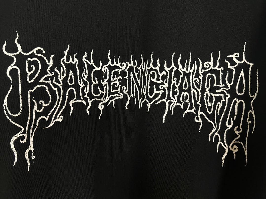 Black T-shirt close-up of white gothic dripping logo lettering