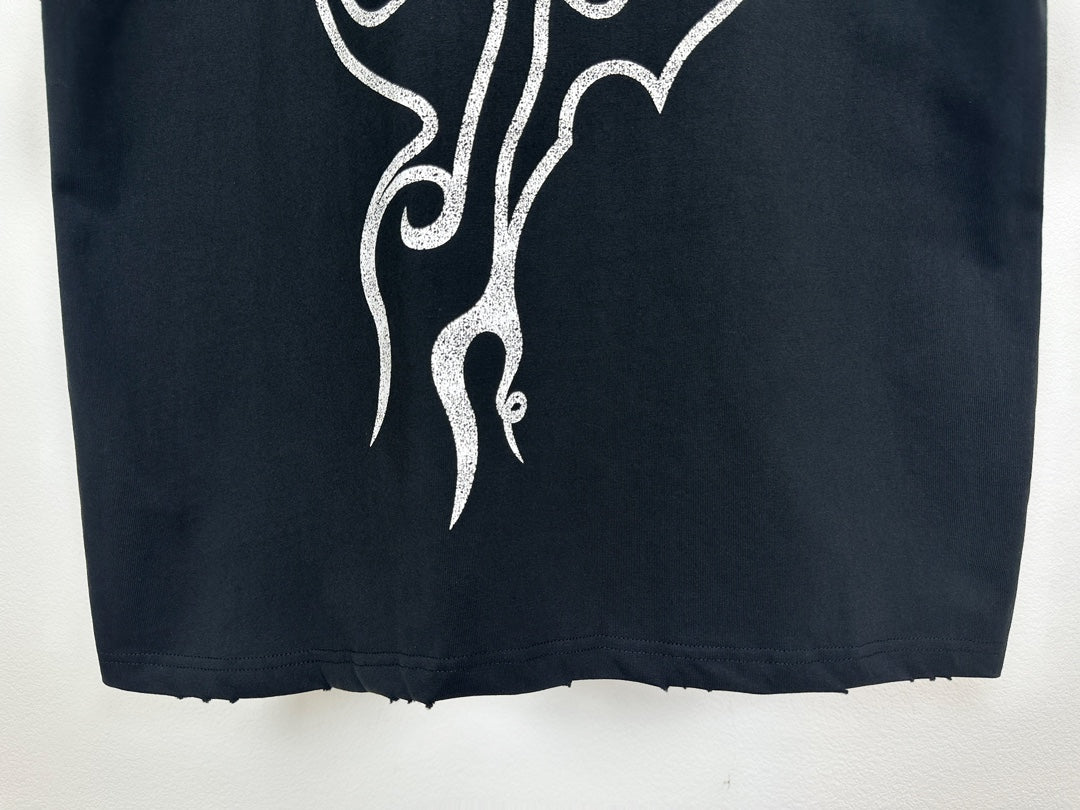 Black T-shirt hem with white gothic logo detail