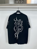 Black T-shirt with large white flame-style graphic on front