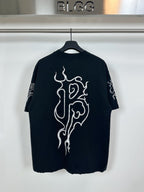 Black T-shirt with large white flame-style graphic on front
