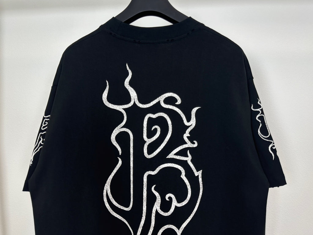 Black T-shirt with white flame monogram graphic on back