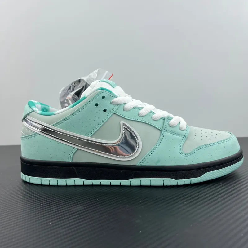 Side profile of aqua low-top sneakers with silver swoosh and black sole