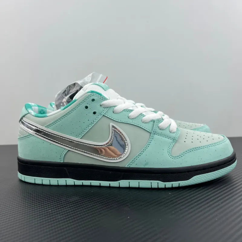 Aqua low-top sneaker side view with silver swoosh and teal heel lining