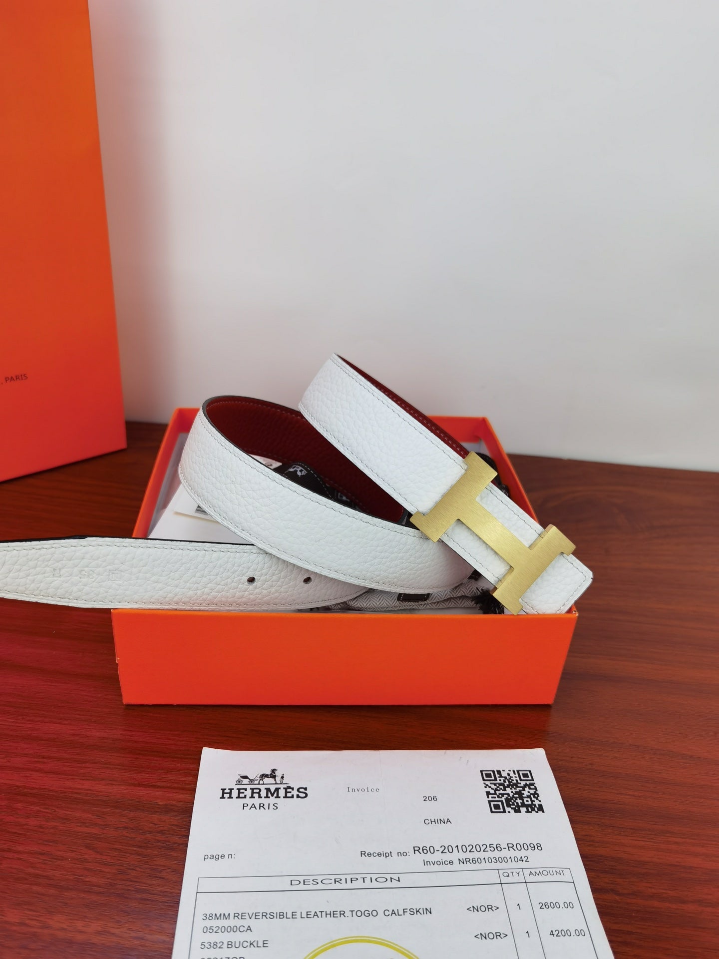 Hermes reversible belt with light blue leather strap and gold-toned buckle detail