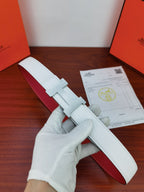 Hermes reversible belt with light blue textured leather strap and silver-toned buckle