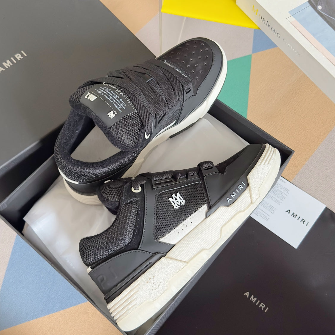 Amiri lace-up sneakers in dark tones with textured paneling and white rubber sole