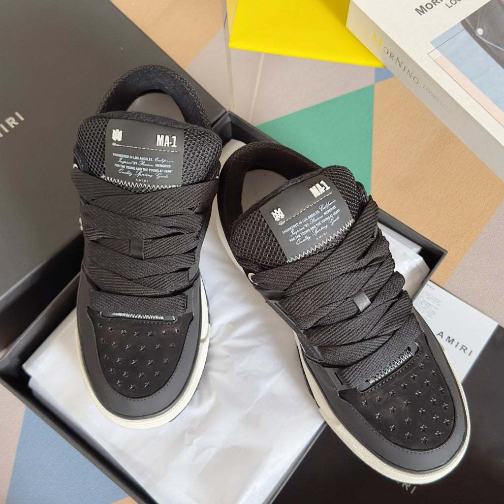 Amiri sneakers in dark mesh with black laces and white rubber sole, two pairs shown