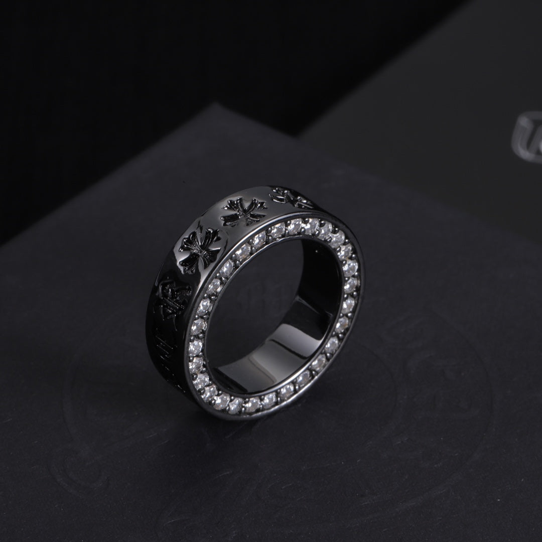 Dark-tone statement ring with crystal halo border and engraved side details