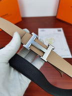 Hermes reversible belt close-up: light beige leather with metallic H buckle bar