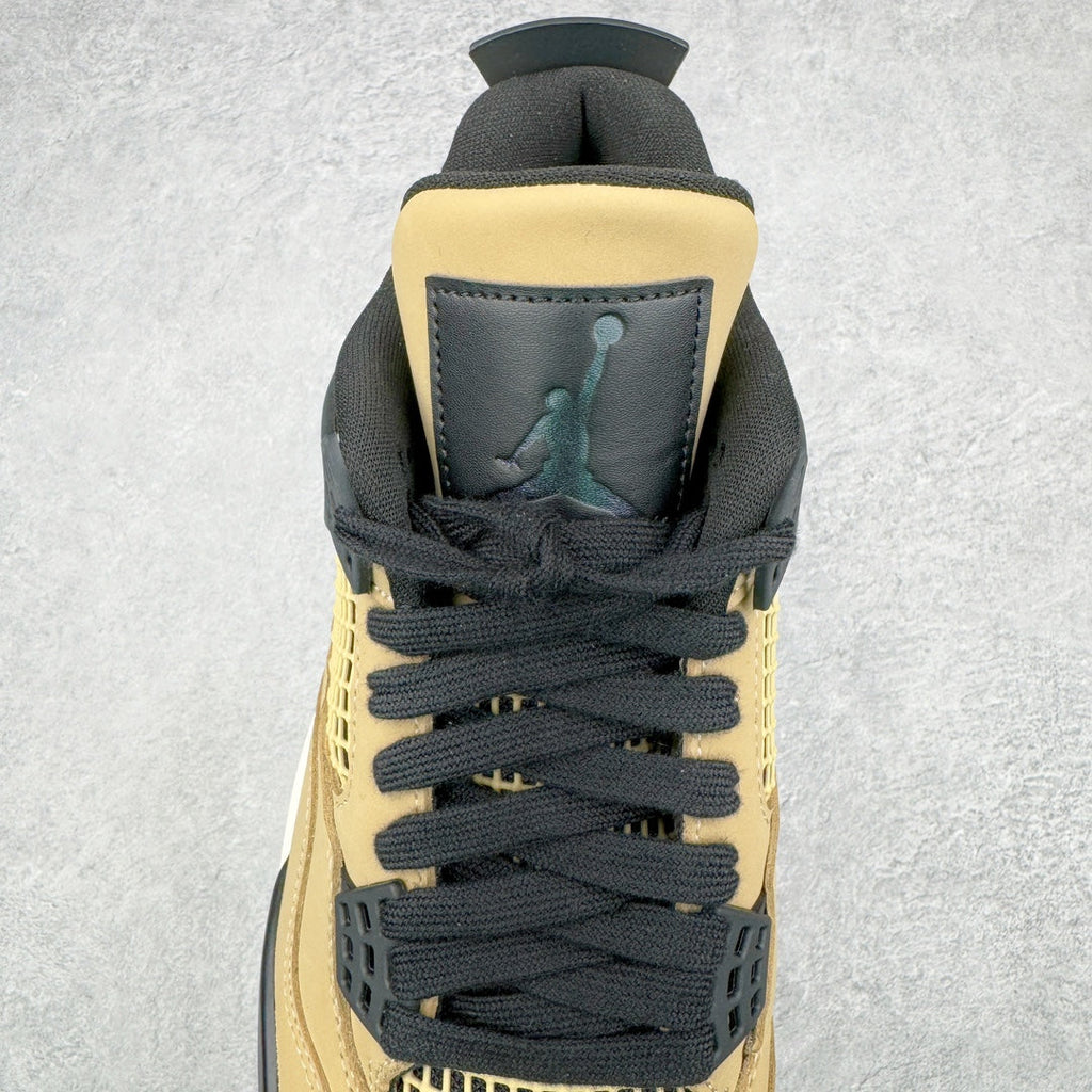 Black lace-up sneakers with beige heel tab and Jumpman logo on heel